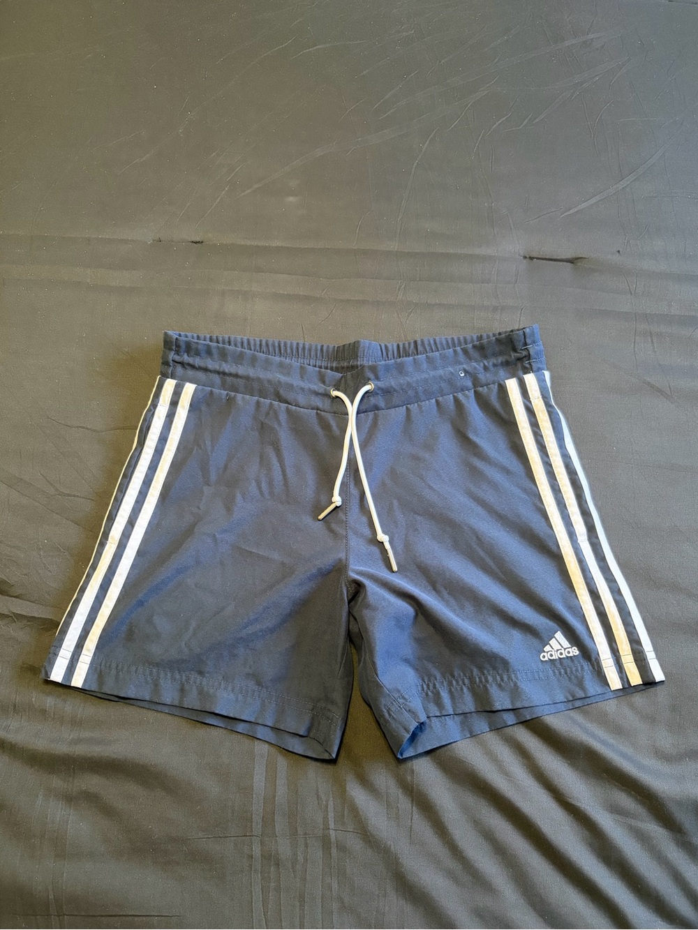 Vintage 2000s Adidas navy blue shorts with white stripes. Size Xs.